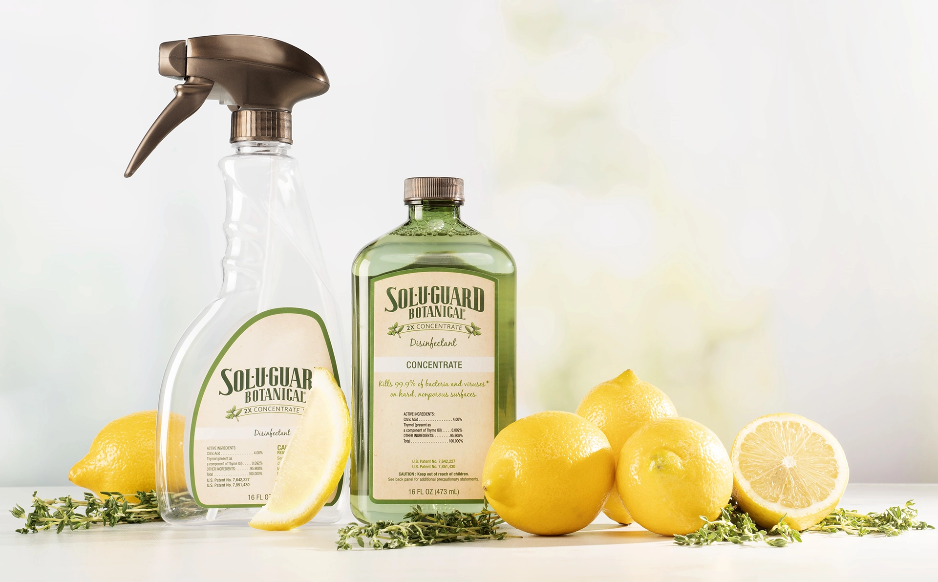 A bottle of Sol-U-Guard Botanical concentrate next to lemons.